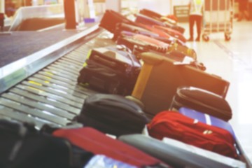 photo blurred Suitcase, luggage with staff member managed services luggage bag Circulating conveyor...