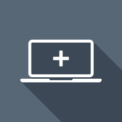 Fototapeta premium Laptop or notebook computer with medical cross on screen. Simple