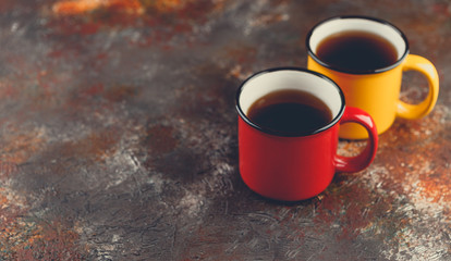 Enameled cup of hot tea