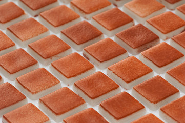 little brown ceramic tile, macro shooting, majolica. for the catalog