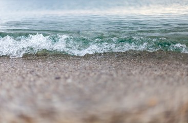 Closeup of Wave of the Sea on a Beach
