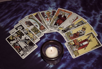 Tarot card spread with candle