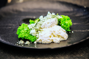 Modern food stylist decorating meal for presentation in restaurant. Closeup of food stylish. Restaurant serving