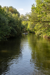 Picture from the river elster in the near from karl heine canal.this is a beautiful way watersports and a. wonderful way for cyclists,skateboarders and pedestrians