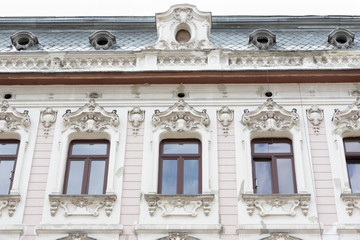 Naklejka premium A beautiful, decorated facade of a tenement house in the Lodz, Poland