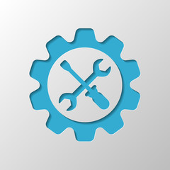 Wrench and screwdriver in gear. Paper design. Cutted symbol with