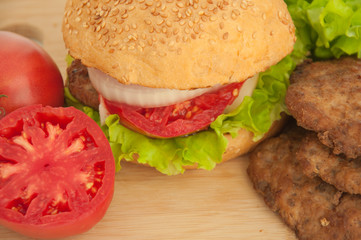 Homemade hamburger with fresh vegetables.