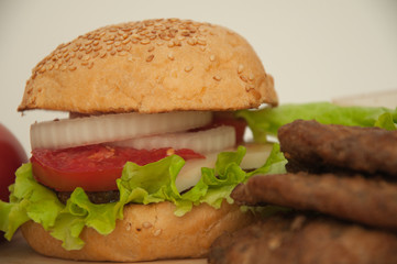 Homemade hamburger with fresh vegetables.