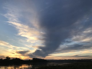 sunset sky sun clouds water nature landscape beauty sunrise red gray blue river morning orange air season summer romance light clouds