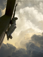Looking upward into these dramatic storm clouds behind Jesus on the Cross represents Jesus Crucifixion on Good Friday and Rising again on Easter Sunday - 218234642