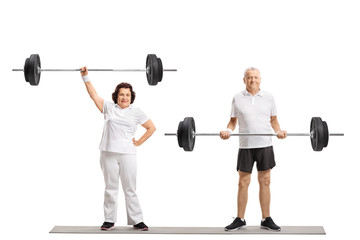 Elderly woman and an elderly man lifting barbells