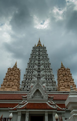 Fototapeta premium The uprisen view angel of Yannasang Wararam temple (Wat Yannasang Wararam) with cloudy sky.