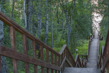 wooden staircase leading down to the river