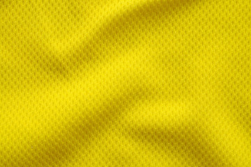 Yellow color football jersey clothing fabric texture sports wear background, close up
