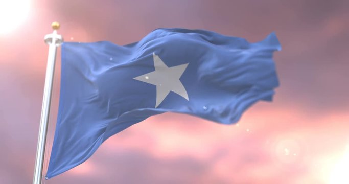 Flag of Somalia waving at wind in slow at sunset, loop