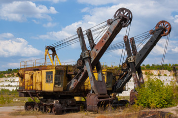 old caterpillar, rusty, abandoned quarry excavators after work