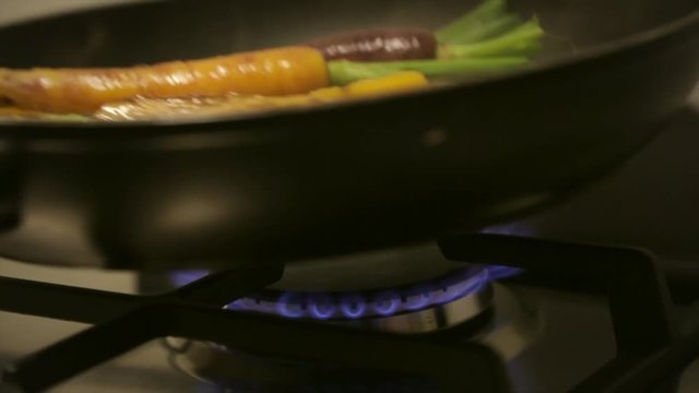Baking / Coocking vegetables like, carrots, sprouts, green asparagus for a celebration meal like Christmas / Thanksgiving. Handheld.