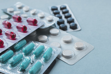 Colorful medicine pills and blisters pack. Pharmaceuticals capsule pills medicine, antibiotics....