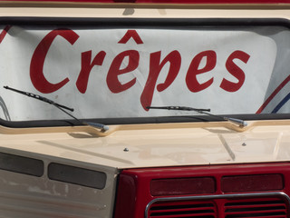 Old vintage van being used to sell French crepes outdoors