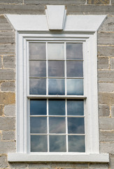 Fototapeta na wymiar A window on the exterior of the Bell Grove Plantation historical site, 18th century early American Colonial mansion, owned by James Madison's family, by Jefferson Monticello