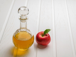 Natural apple cider vinegar transparent in a glass decanter