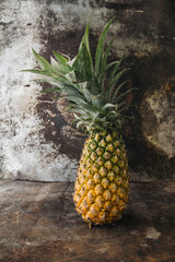 Pineapple on rustic background