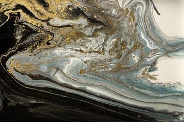 Marble abstract acrylic background. Marbling artwork texture. Agate ripple pattern. Gold powder.