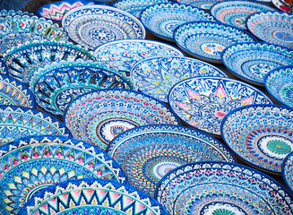 Decorative ceramic plates with traditional uzbekistan ornament on street market of Bukhara. Uzbekistan, Central Asia, Silk Road