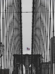brooklyn bridge black and white with american flag in new york sad mood