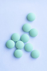 Medication pills. White pills, white background