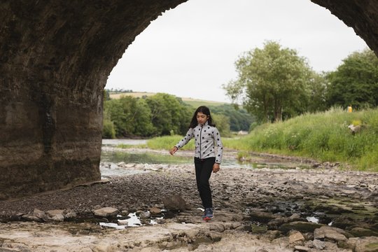 Girl Walking Near River Side