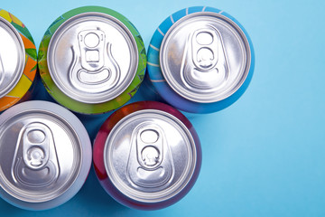 metal cans with fizzy drinks