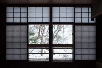 Japanese paper window and winter snow scene　障子窓と雪景色