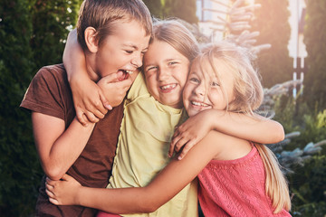 Fototapeta premium Three cute little friends cuddling and play.