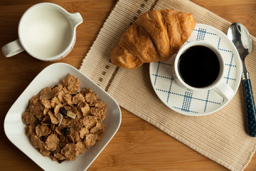 Breakfast in bed, cozy hotel room.