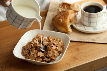 Healthy breakfast in bed with coffee