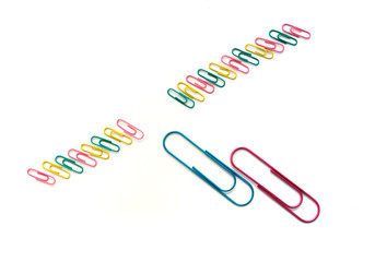 Paper clips on a white background metaphora for fertilization fertility