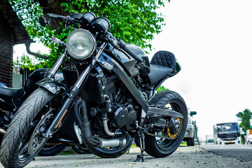 Vintage motorcycle parking on the road. Side view, close up