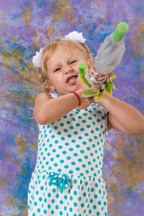 Child, little girl posing under an umbrella. Weather forecast.