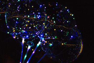 Colored lights on the balloons glow in the dark
