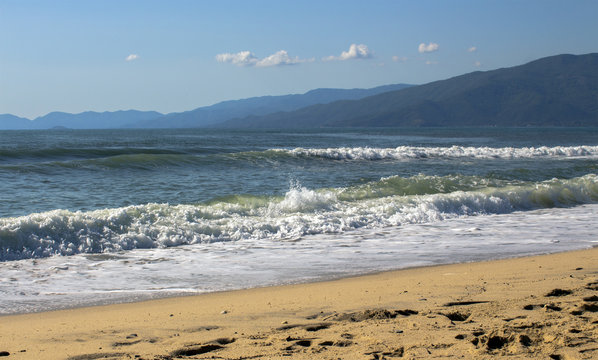 Marine landscape from the beach of camping Asprovalta against the silhouettes of mountain hills. Aegean Sea, Greece.
