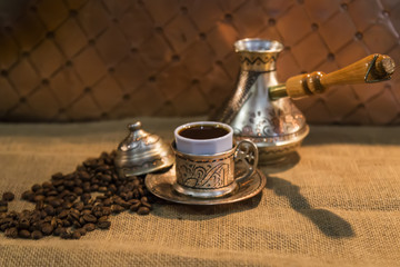 coffee concept for cafe. copper kitchenware  on the wicker background.