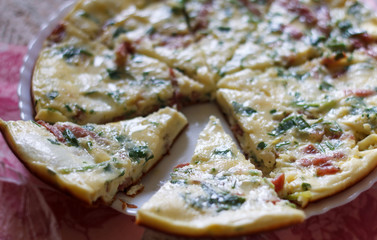 tasty magnificent omelet with greens and sausage
