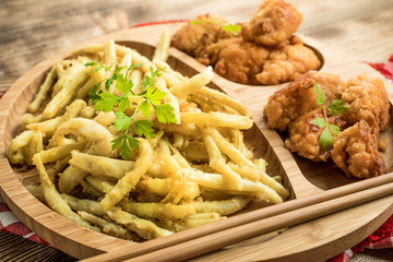 Chicken nuggets with yellow beans.