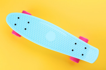 Skateboard on yellow background