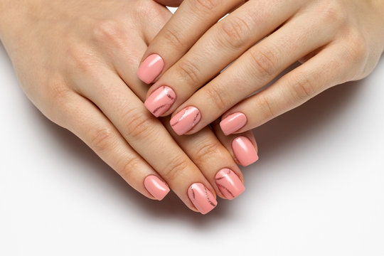 pink manicure with gold strips on square short nails
