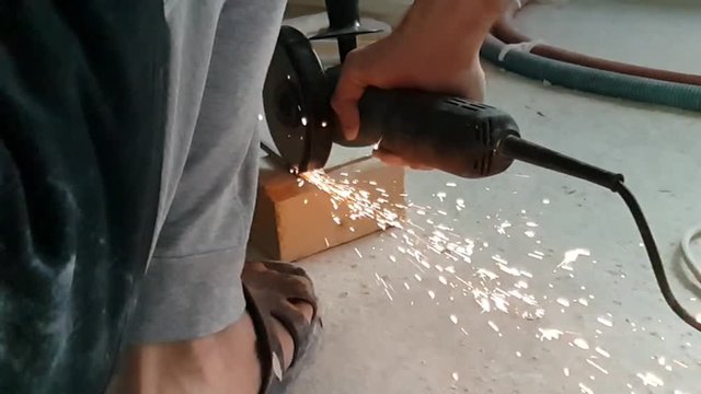 Angle grinder, sparks in super slow motion