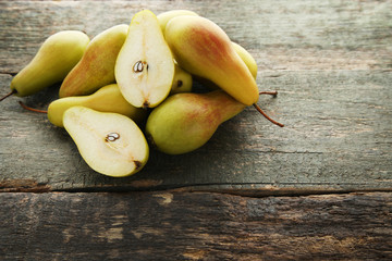 Ripe and sweet pears on grey wooden table