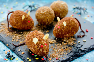 Mice cakes - funny and spooky Halloween dessert idea for kids, edible mouse cookies with red eyes and almonds ears, cute rat cakes