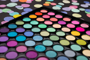 Make-up eyeshadow palette with colorful confetti